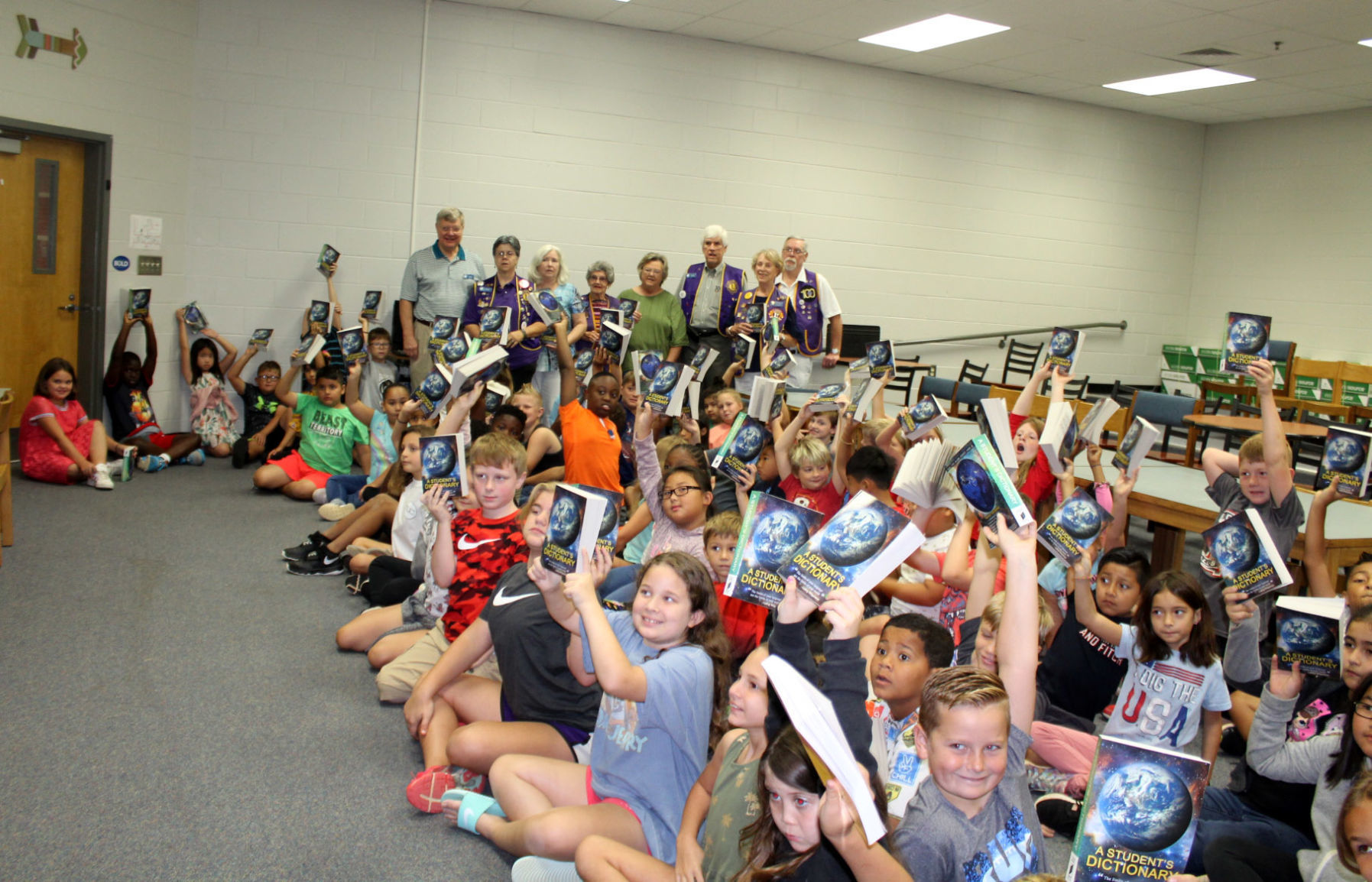 Winder Noon Lions Club hands out dictionaries to elementary school students